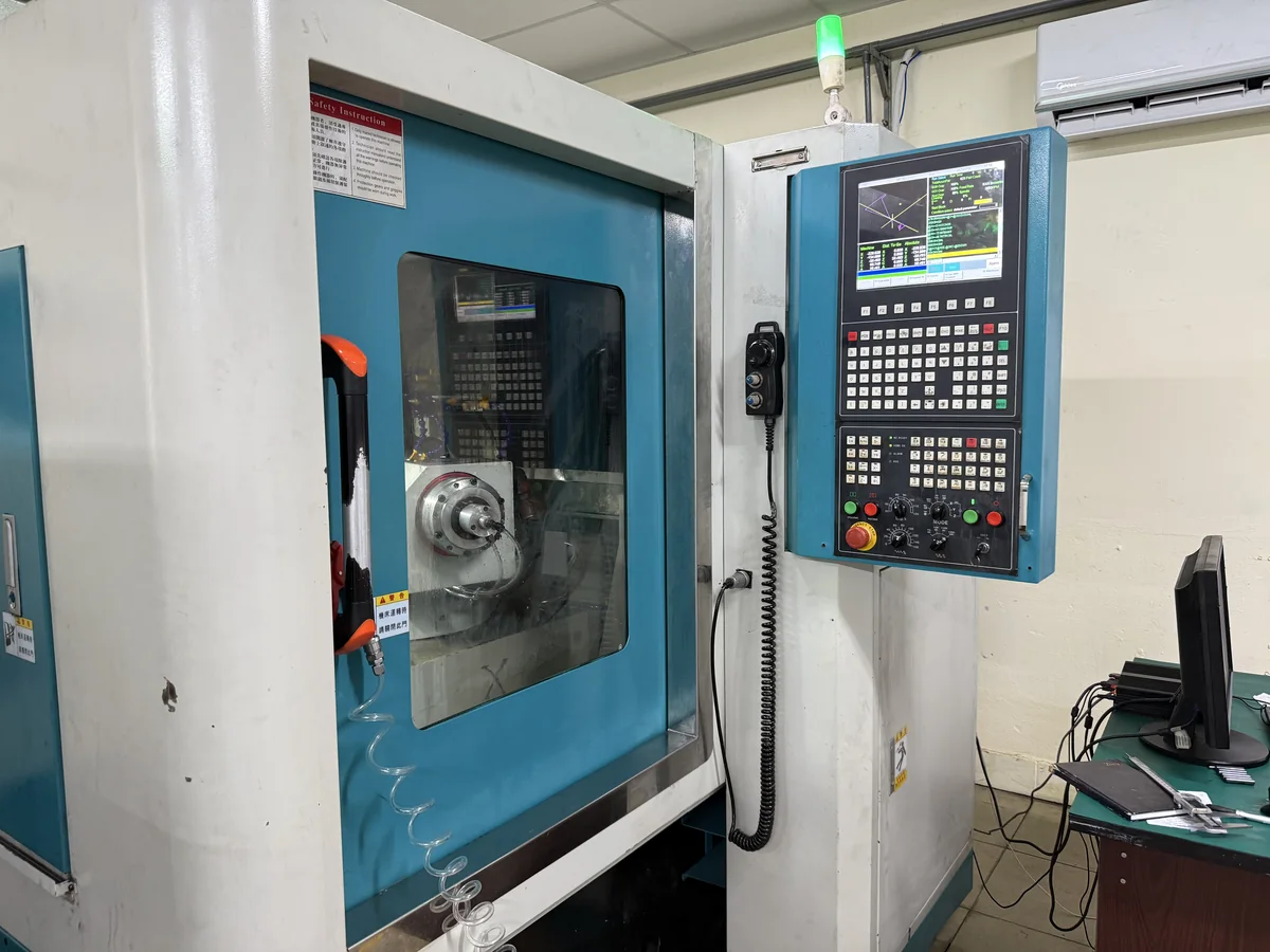 CNC tool grinder in the tool room at Far East High Tech, Vietnam