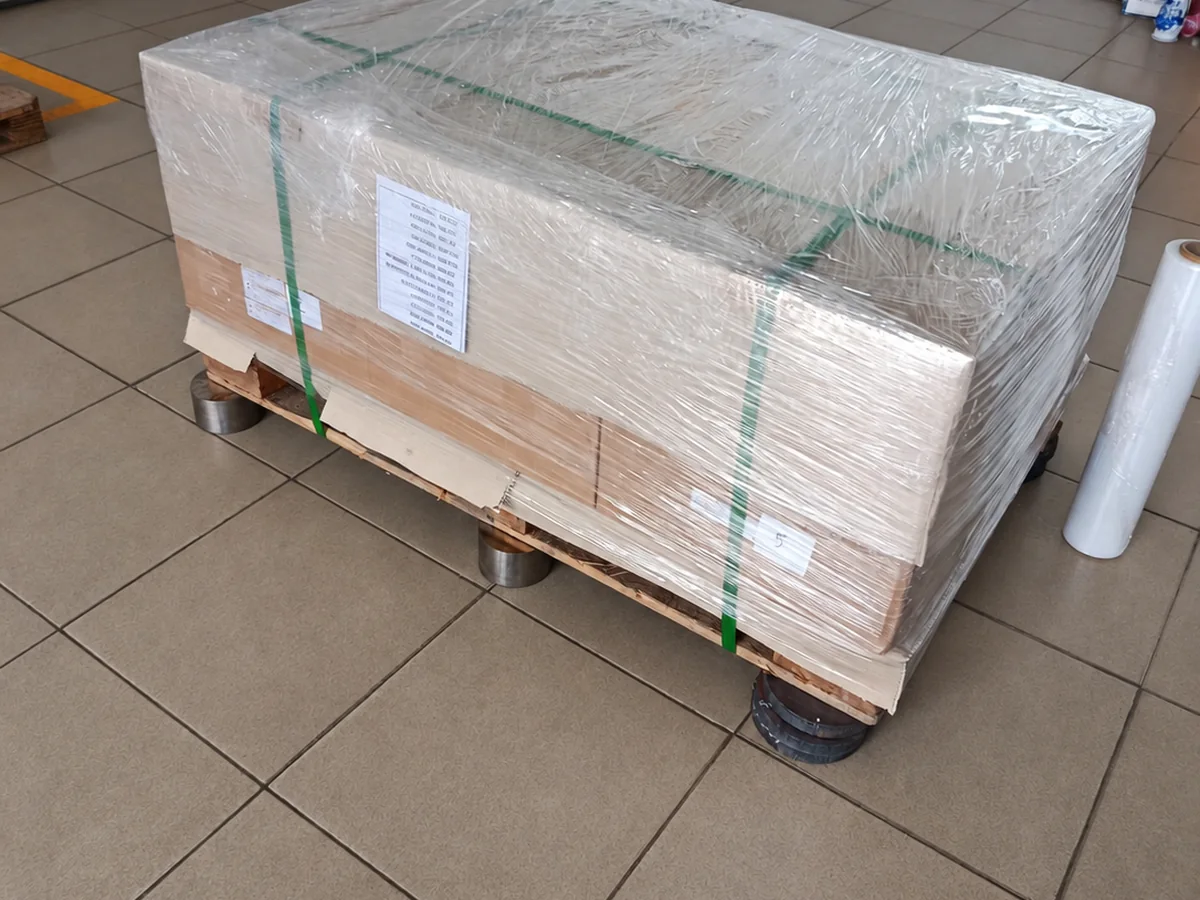 Parts wrapped and labelled on an export pallet.