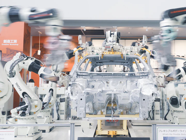 Robotic arms assembling a car body on an automotive production line