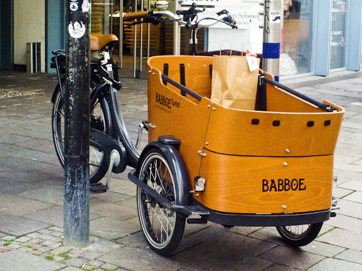 Cargo bike with a front box parked on a city street