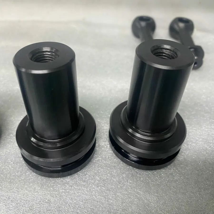 CNC turned black stepped spacers with internal thread, flange and groove