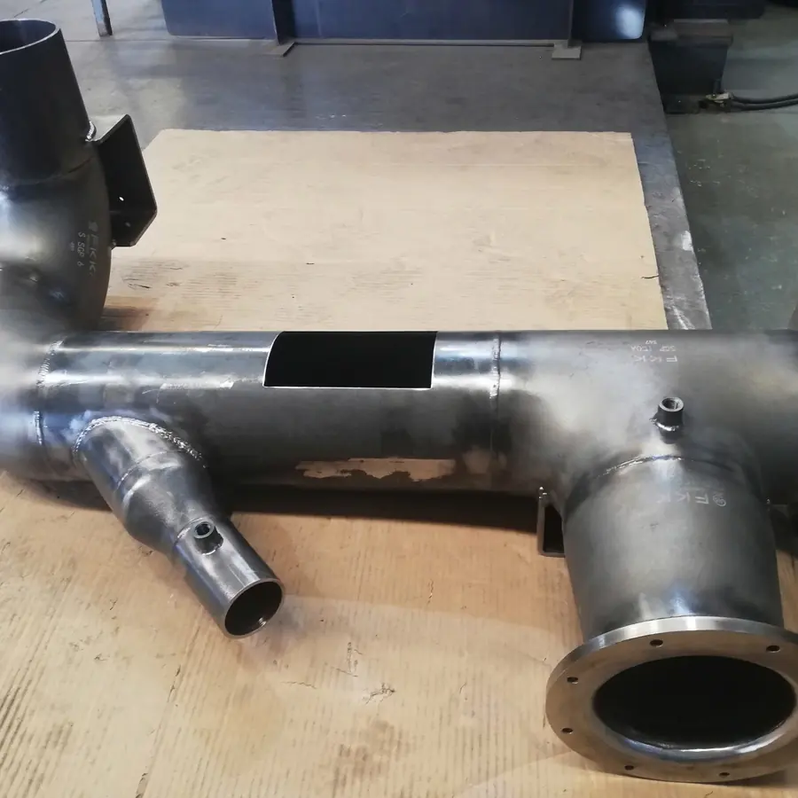 Welded pipe spool with elbow, reducer branch, bolted flanges and threaded ports